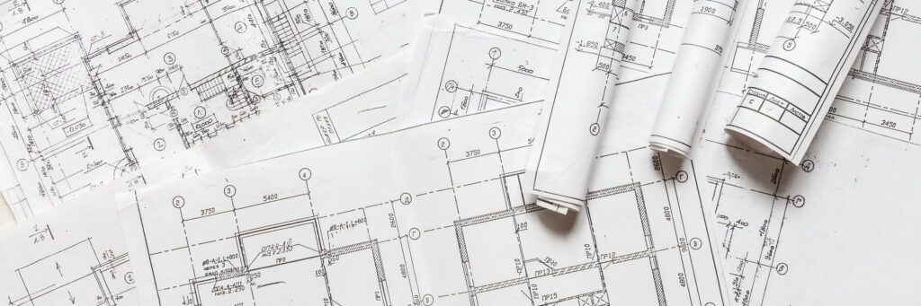architect design working drawing sketch plans blueprints and making architectural construction model in architect studio,flat lay
